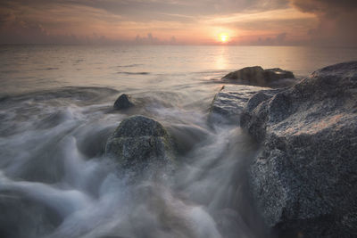 Scenic view of sea against sky during sunset