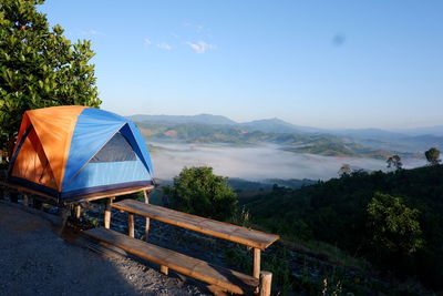 Scenic view of mountains against blue sky