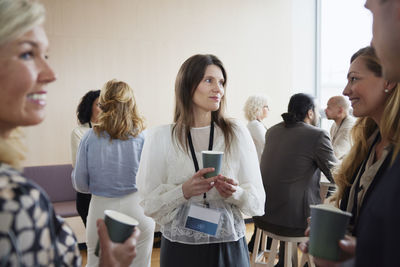 Businesswomen talking during coffee break