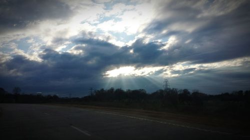 Scenic view of landscape against cloudy sky