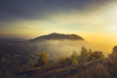 Scenic view of landscape against sky during sunset