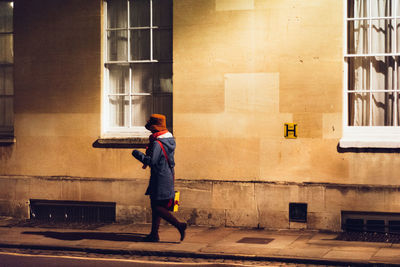 Full length of woman walking in city