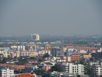 High angle view of buildings in city against clear sky