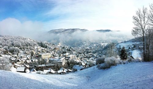 Scenic view of landscape against sky during winter