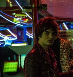 Portrait of young man standing at night