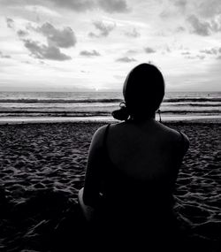 Rear view of man looking at sea