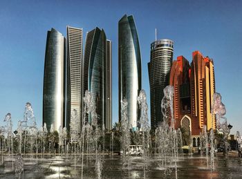 Low angle view of modern buildings against clear sky