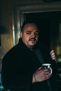 Portrait of man drinking coffee