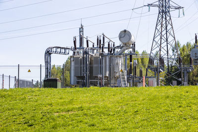 High voltage electricity towers, transmission power lines, and distribution substation