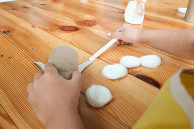 High angle view of woman preparing food on table