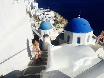 Woman walking on steps in city