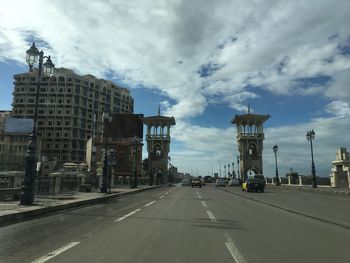 Road in city against sky