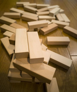 High angle view of piano keys on wooden table