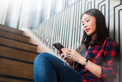Young woman using mobile phone