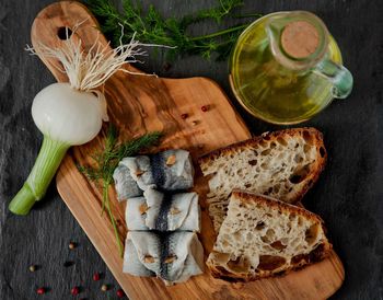 High angle view of bread on cutting board