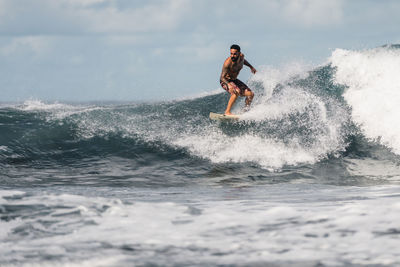 Man surfing waves in atlantic ocean, tenerife, spain