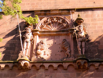 Low angle view of statue against building