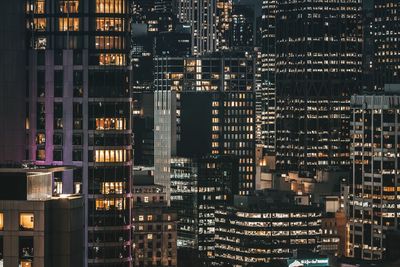 Illuminated buildings in city at night