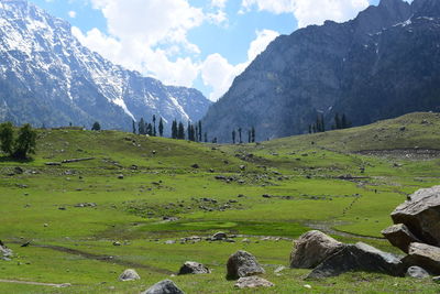 Scenic view of green landscape and mountains