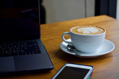 Coffee cup on table