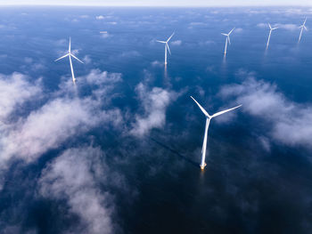 Low angle view of wind turbine against sky