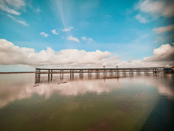 Pier over sea against sky