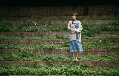 Full length of woman standing on field