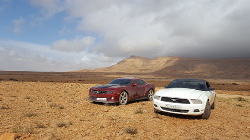 Vintage car on mountain against sky