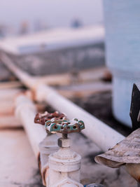 Close-up of rusty chain on boat