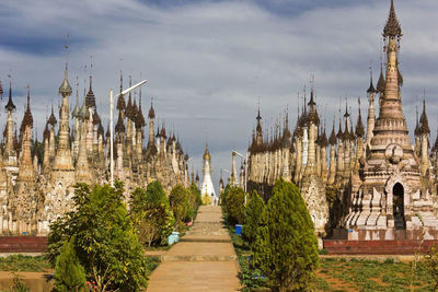 Panoramic view of temple amidst buildings against sky