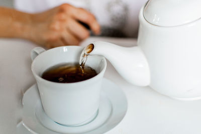 Close-up of tea cup on table