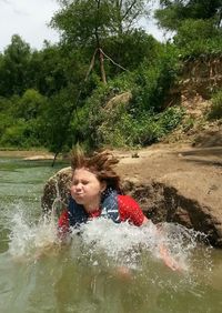 Portrait of baby girl in water