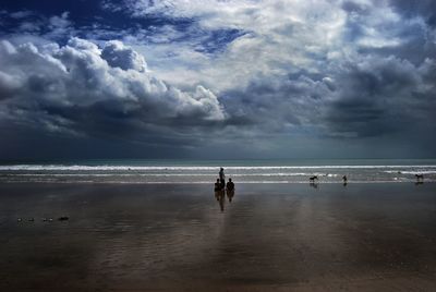 Scenic view of sea against cloudy sky