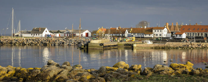 Scenic view of harbor against sky