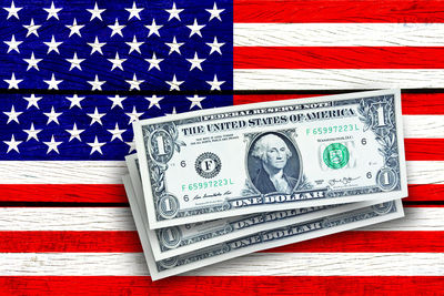 Close-up of american flag painted wooden table with paper currency