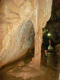 Rear view of women on rock formation