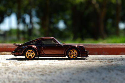 Close-up of toy car on street