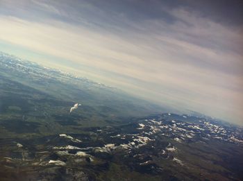Aerial view of landscape and cityscape against sky