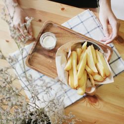 High angle view of person preparing food on table