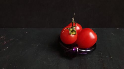 Close-up of red tomatoes on table