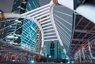 Low angle view of illuminated buildings against sky at night