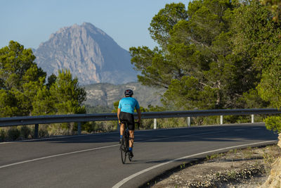 Man riding a bicycle on a costa blanca mountain road