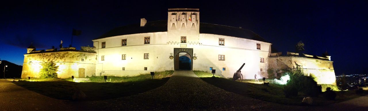 building exterior, architecture, built structure, night, church, illuminated, place of worship, clear sky, history, religion, street, blue, the way forward, facade, sky, building, outdoors, old, exterior