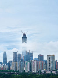 Modern cityscape against sky