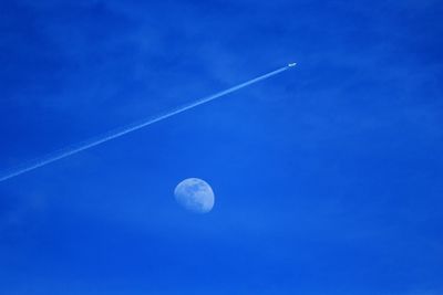 Scenic view of moon against blue sky