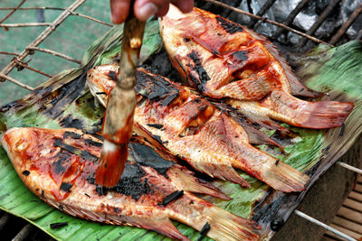 High angle view of meat on barbecue grill