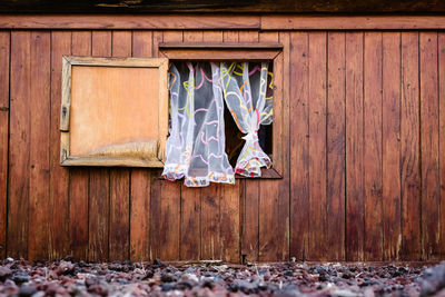 Clothes drying on wooden door of building