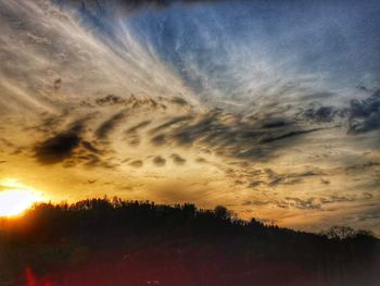 Scenic view of dramatic sky during sunset