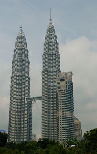 Modern buildings in city against sky