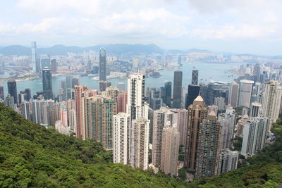 Aerial view of victoria harbour against cloudy sky